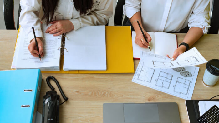 Contractor's staff members planning new commercial renovation project