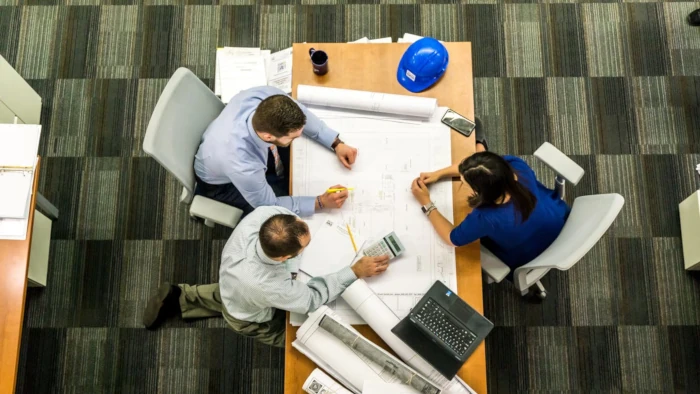 Members of interior office renovation team in discussion