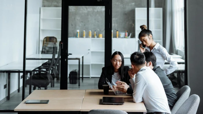 Staff members discussing about office interior requirements